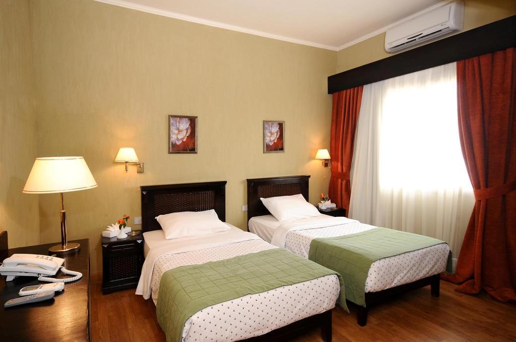 Green Plaza Inn Alexandria Zimmer foto